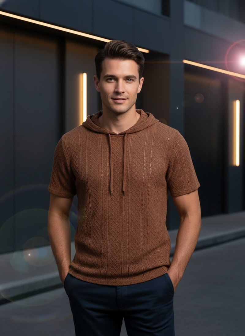 Male model wearing an earth-tone AUREN Textured Knit Hooded Polo, waist up, in a minimalist urban setting.